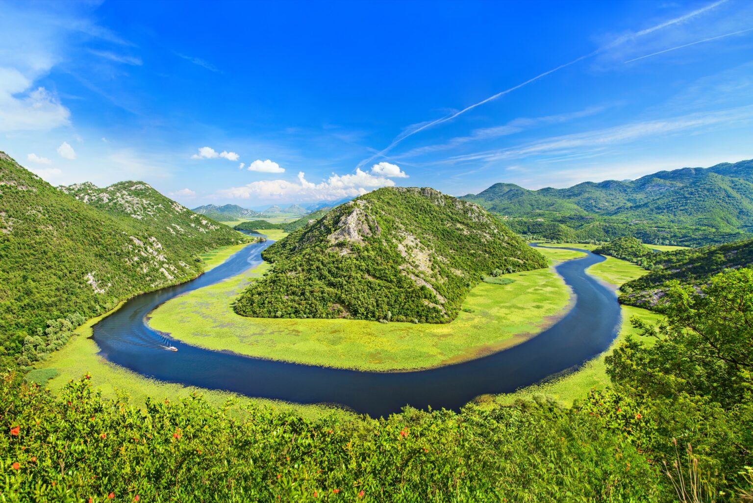 Canyon of Rijeka Crnojevica river in Skadar Lake National Park. One of the most famous views of Montenegro. The Green Pyramid and the bend of the river between mountains.